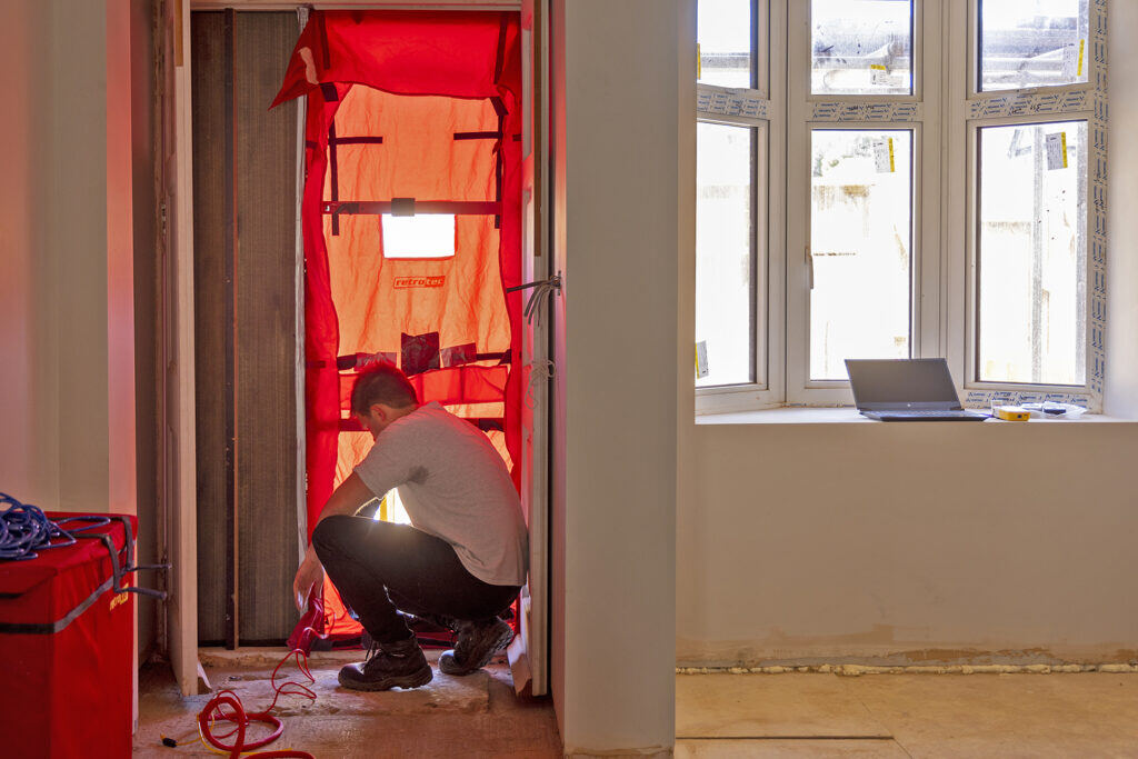 Image showing Airtightness Test at Red Brick House, North London, showing the blower door test being set up