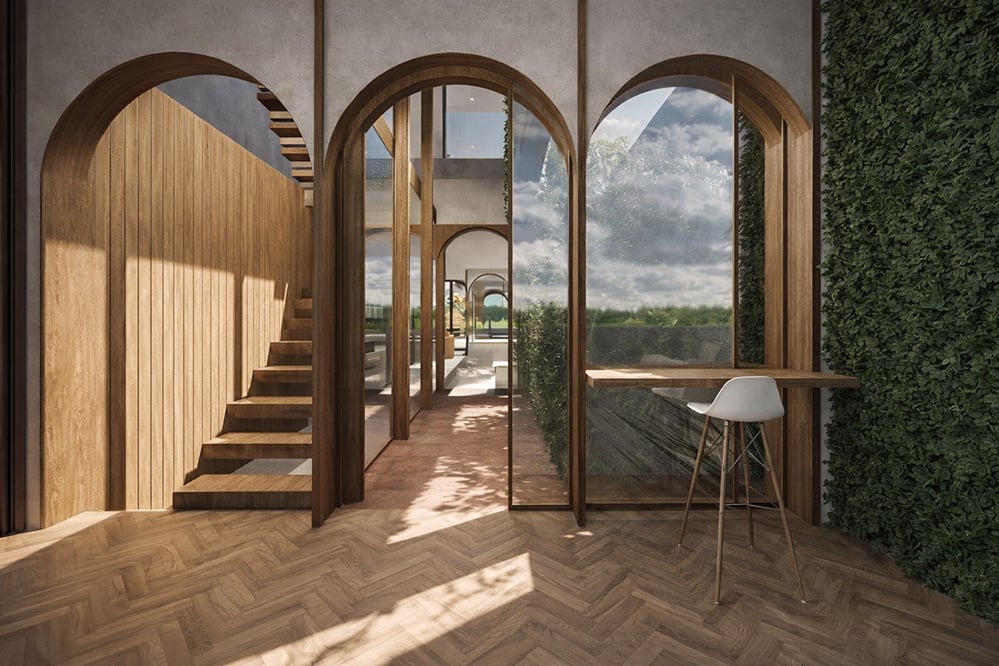 Interior view of a London home extension with repeated timber arches, herringbone floor and built-in desk, showcasing natural light, crafted joinery and spatial flow in a contemporary sustainable design.