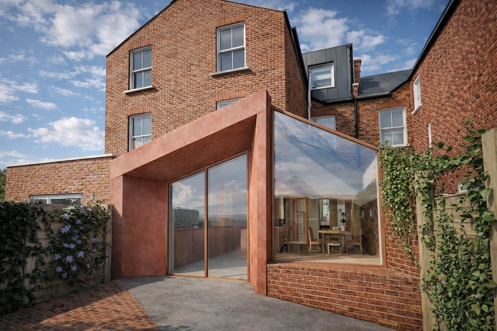 Contemporary low-energy garden extension to a Victorian house in London, featuring folded architectural form, large glazed openings and a fabric-first retrofit strategy.