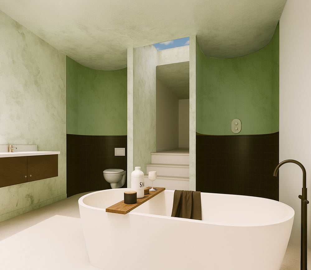 Interior of the bathroom at Corten House, with curved green plaster walls, freestanding bath, skylight, textured finishes and soft natural light forming part of the AECB standard retrofit.