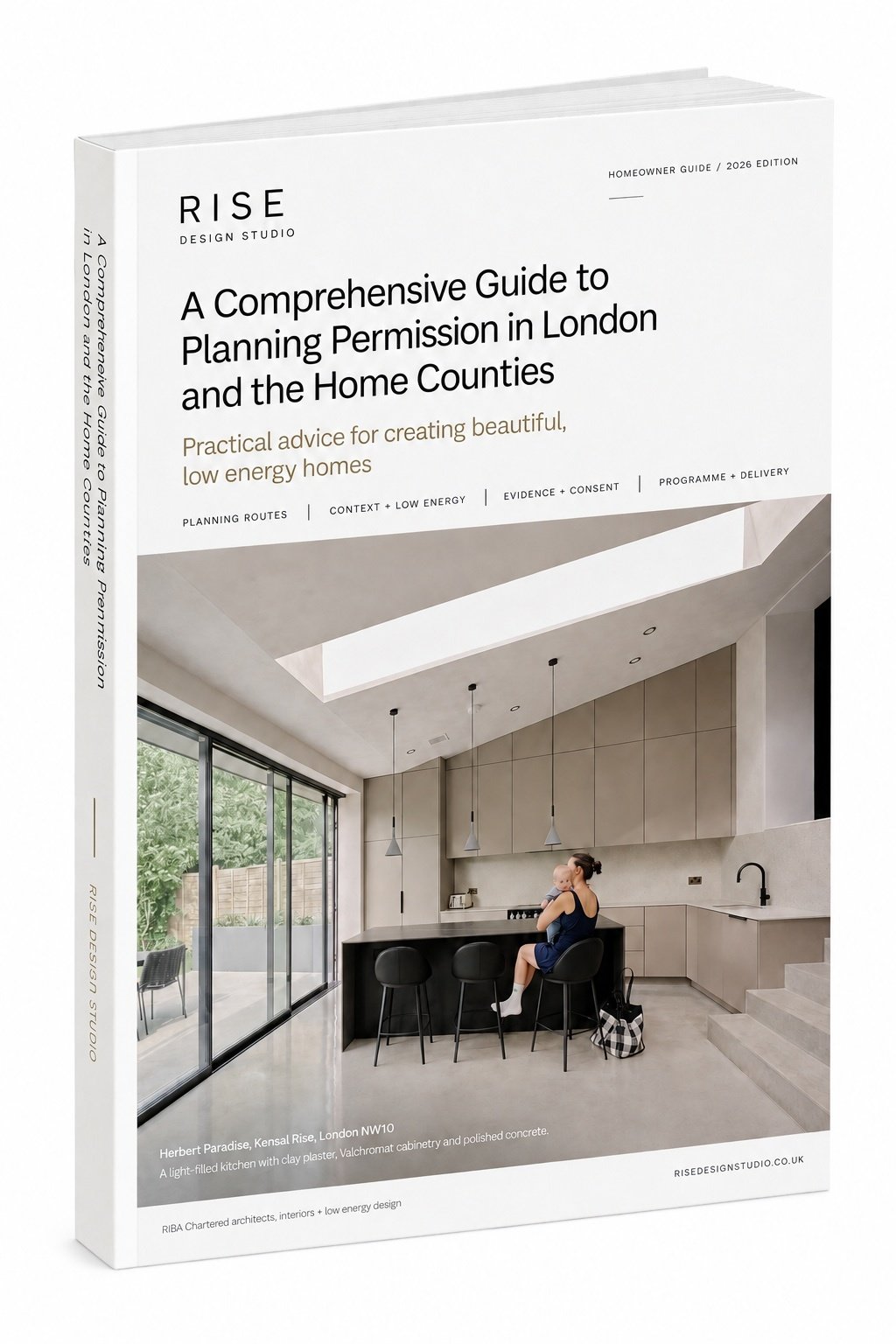 Cover of the RISE Design Studio 2026 homeowner guide to planning permission in London and the Home Counties, showing a light-filled kitchen extension at Herbert Paradise, Kensal Rise, with a long rooflight, clay plaster, Valchromat cabinetry and polished concrete. RISE Design Studio.