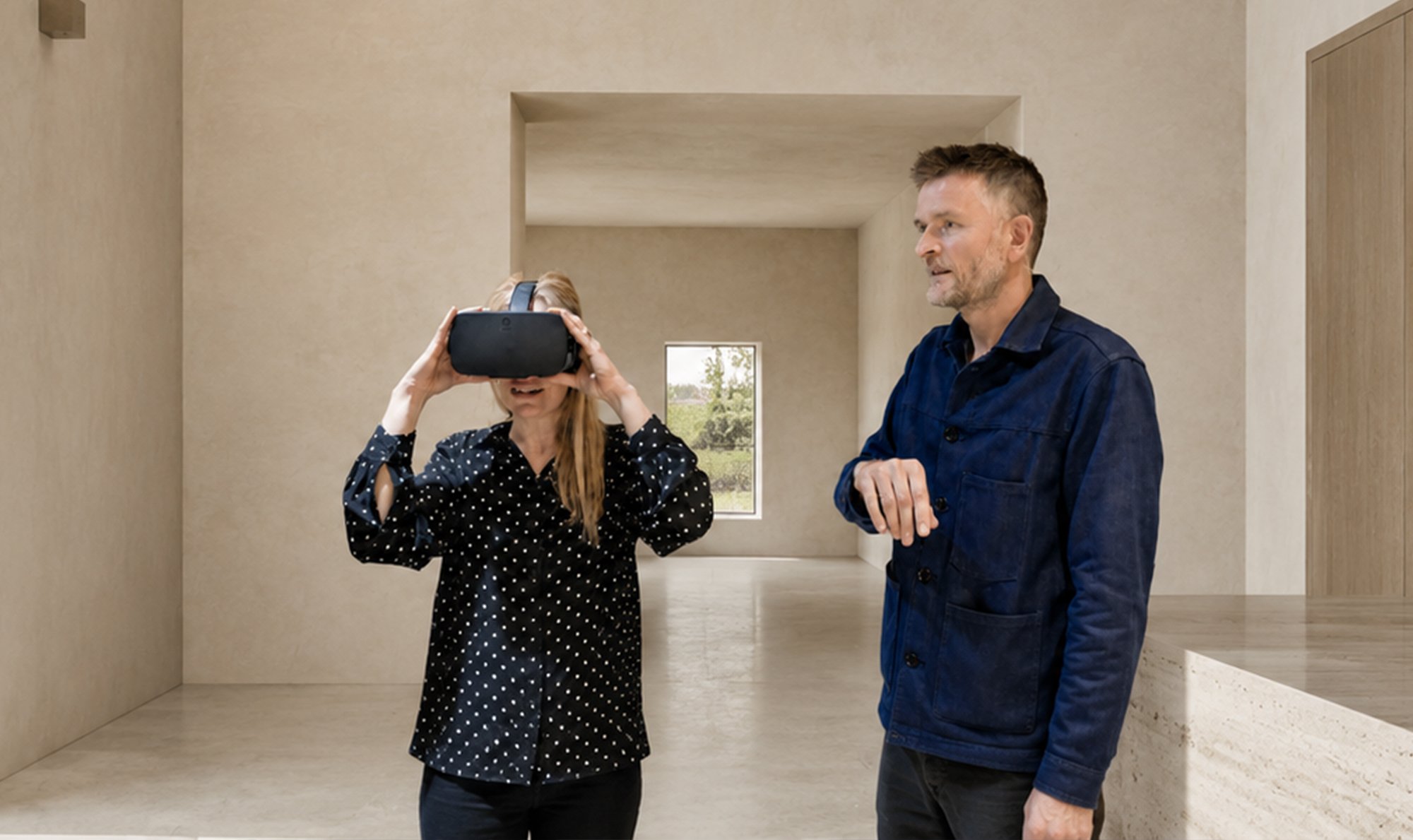 Sean Ronnie Hill, Director Architect at RISE Design Studio, guiding a client through a virtual reality review of an architectural project.
