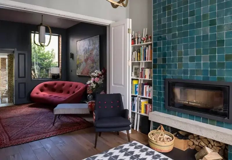 Sustainable home interior design with fireplace by RISE Design Studio in London