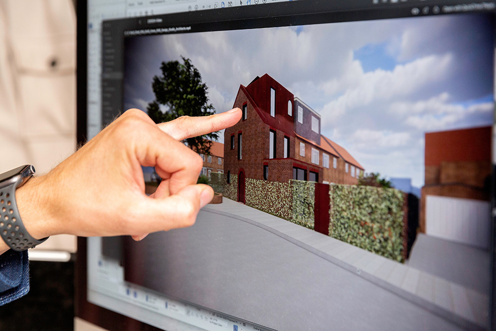 Architect working on 3D BIMx model on computer screen