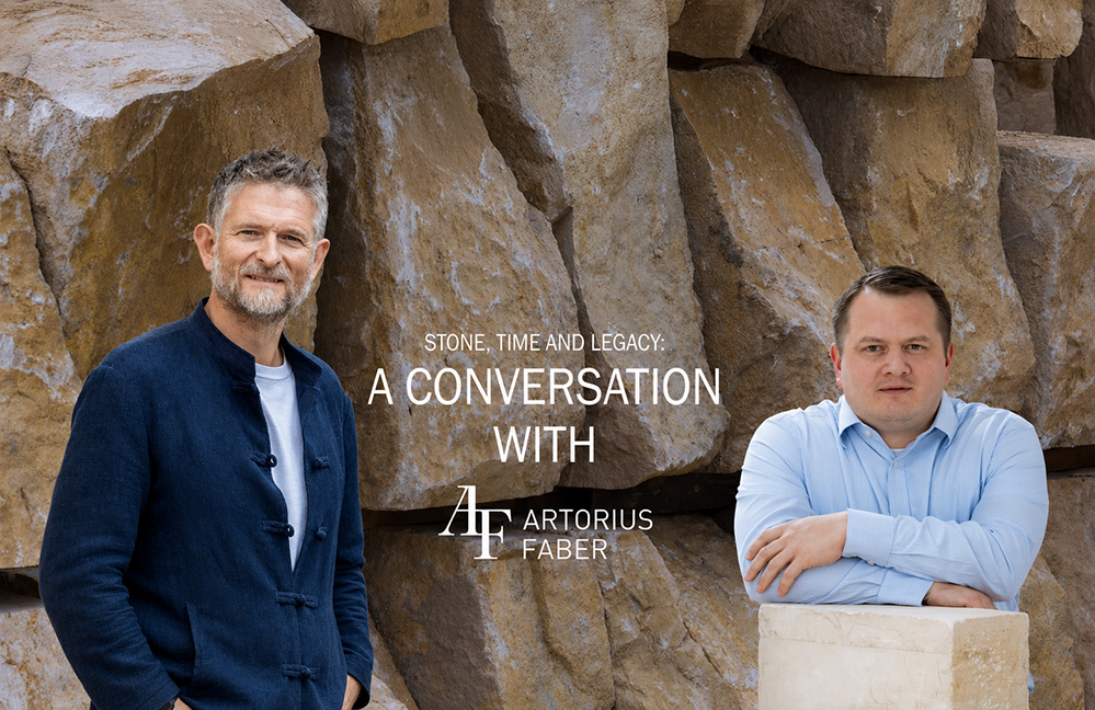 Title card for a conversation on natural stone: two men, Sean Ronnie Hill of RISE Design Studio and Edward Smith of Artorius Faber, stand against a wall of large raw quarried stone blocks, with the Artorius Faber logo. RISE Design Studio.