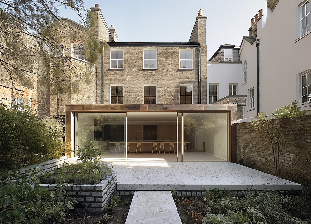 Rear view of a Georgian house with a contemporary copper-clad extension featuring large sliding glass doors, opening onto a minimalist garden terrace designed for low-energy living.