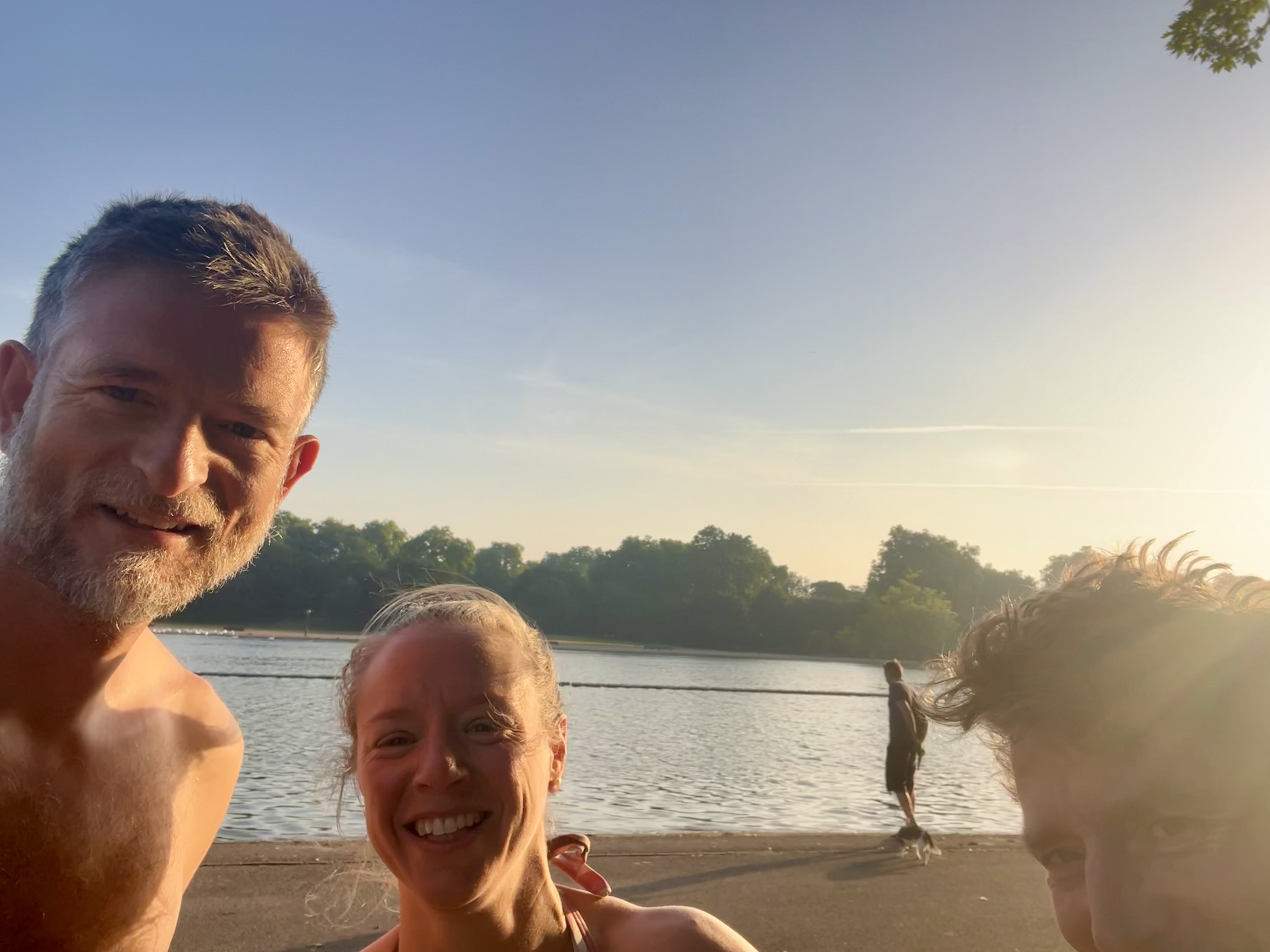 Architect Sean Ronnie Hill and client Zoe Birch of Physio Motion Mayfair at the Serpentine Lake, Hyde Park, London, after an early morning open water swim during the May 2026 heatwave.