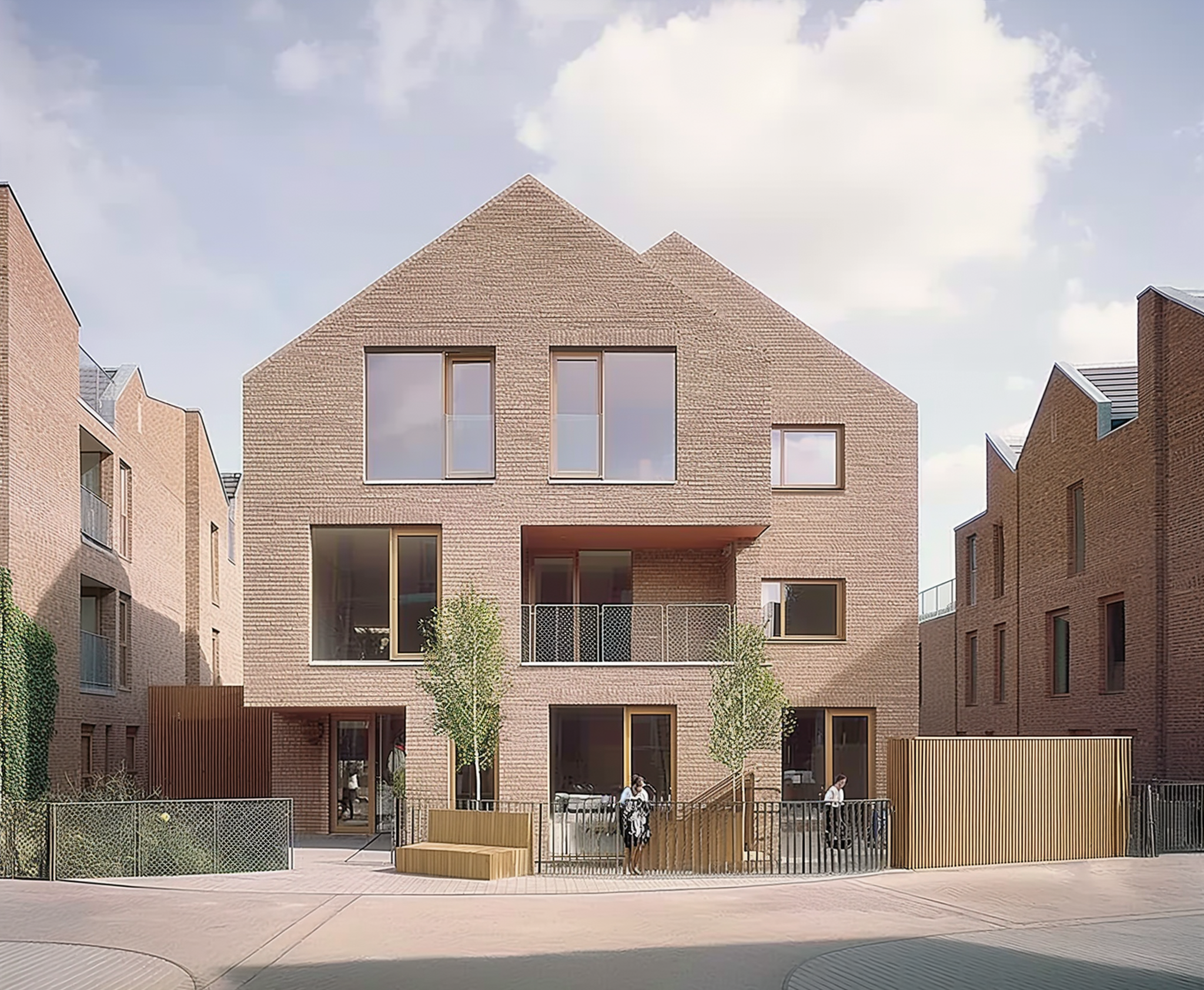 Modern brick housing development with pitched roofs and large windows, designed by a small architectural studio. The image showcases sustainable, community-oriented design with greenery, fencing, and public seating in a well-integrated urban setting.